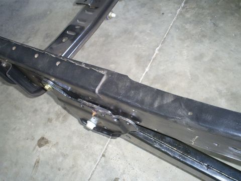 1992 Ford Bronco - A close-up view of a vehicle's chassis, showing structural components and mounting points.