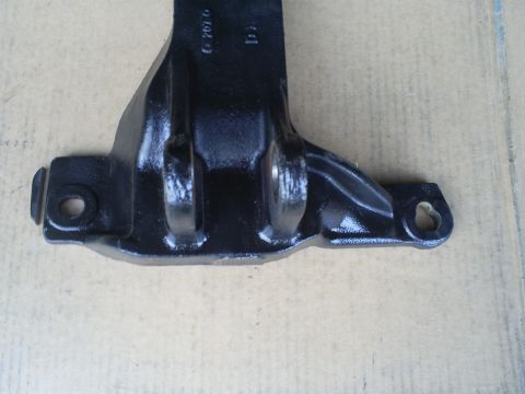 1992 Ford Bronco - Close-up of a black metal bracket, possibly a motor mount, with visible casting numbers.