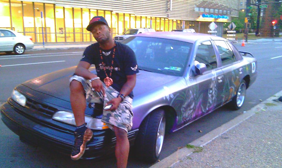 1995 Ford Crown Victoria with custom Joker paint, parked curbside