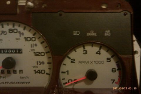 2000 Mercury Grand Marquis - Close-up of a vehicle's dashboard gauges, including the speedometer and tachometer.