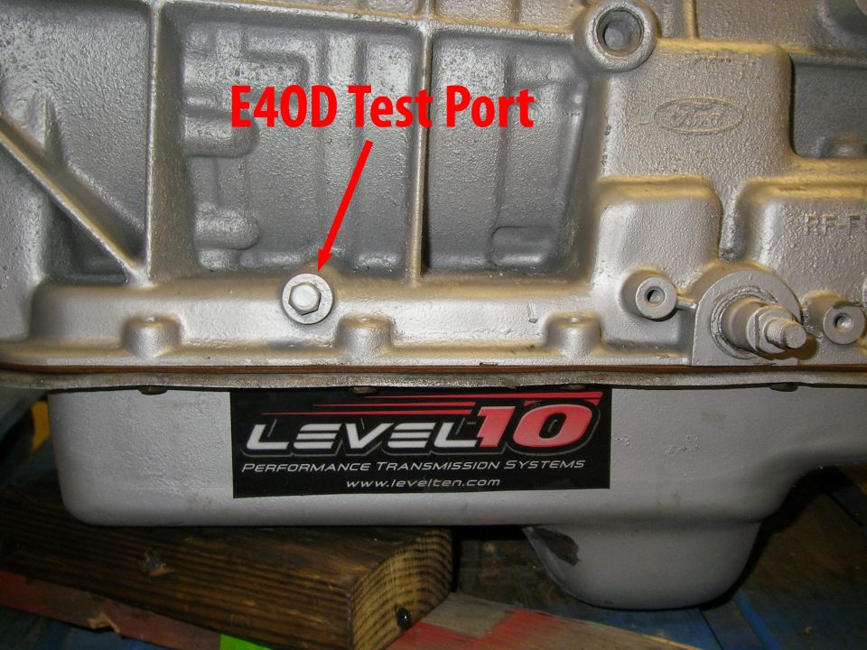 Transmission pan with Level 10 Performance Transmission Systems sticker and E4OD Test Port label