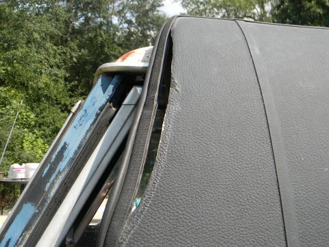 1979 Ford Ranchero - A close-up view of a vehicle's roofline and window frame shows wear and peeling paint.