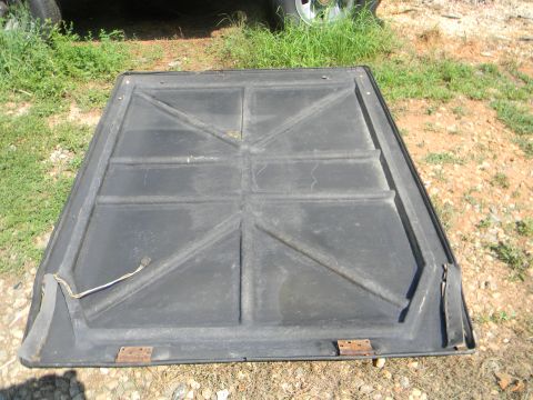 1979 Ford Ranchero - The underside of a black tonneau cover, showing its reinforced grid structure and hinges.
