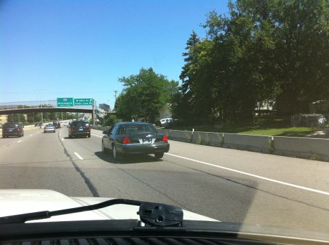 2003 Ford Crown Victoria - St Louis Park Police all black slick top with street appearance package.