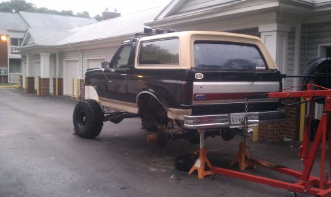 1990 Ford Bronco - This Ford Bronco is on jack stands, showing its rear suspension and drivetrain components.