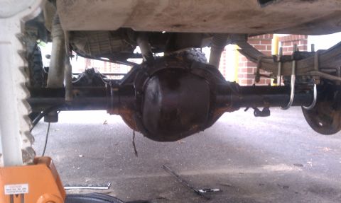1990 Ford Bronco - Underside view of a vehicle's rear axle assembly, showing suspension components.