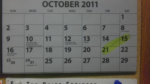 1989 Ford Bronco - A calendar page displays the month of October 2011 with various holidays noted and the 15th marked.