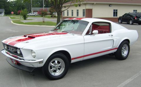 2007 Ford Mustang - This classic white 1967-1968 Ford Mustang Fastback features bold red racing stripes and a matching red interior.