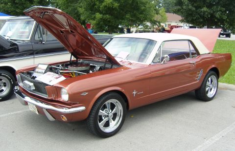 2007 Ford Mustang - Copper 1965 Ford Mustang convertible at a car show, hood and trunk open.