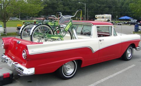 2007 Ford Mustang - A two-tone 1957 Ford Ranchero pickup truck carries two vintage bicycles in its cargo bed.