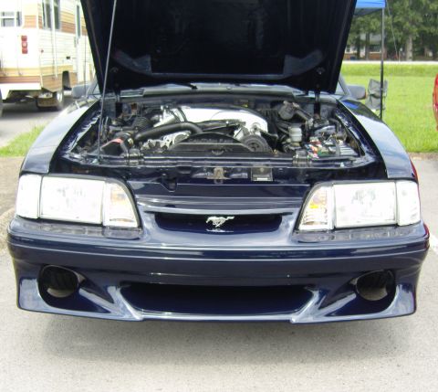 2007 Ford Mustang - Front view of a dark blue 1993 Ford Mustang with its hood open, revealing the engine compartment.
