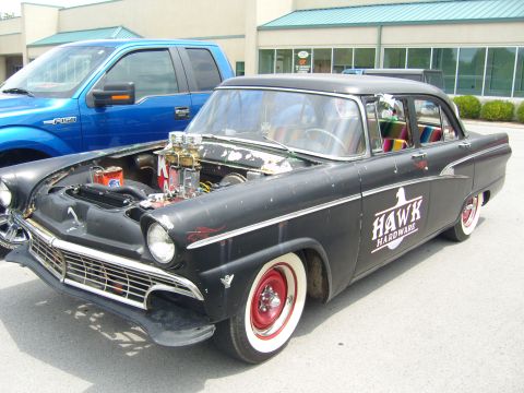 2007 Ford Mustang - This black 1956 Ford sedan features a custom engine build, whitewall tires, and a "Hawk Hardware" logo on its side.