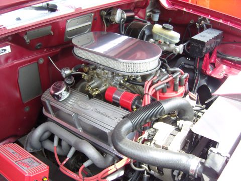 2007 Ford Mustang - Close-up view of a Ford V8 engine, a chrome air cleaner and "Ford" branded valve covers.
