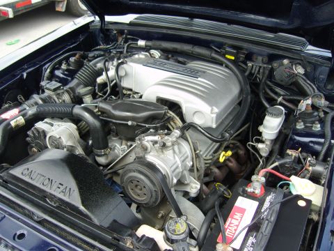 2007 Ford Mustang - Engine bay view of a Ford 5.0L V8, likely from a Fox Body Mustang.