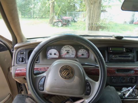 2000 Mercury Grand Marquis - Interior view of a 2000 Mercury Grand Marquis, highlighting the dashboard and steering wheel details.