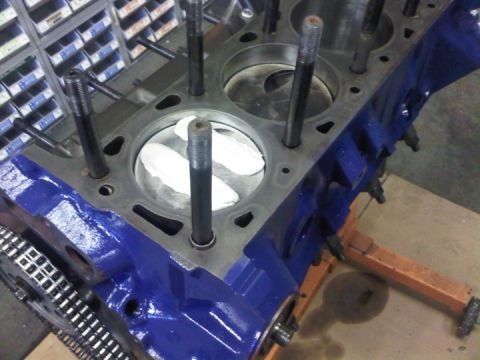 1979 Ford Bronco - Engine block assembly with pistons and connecting rods visible, ready for further work.