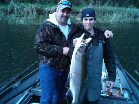 1979 Ford Bronco - Two men proudly display a large fish caught while on a boat trip.