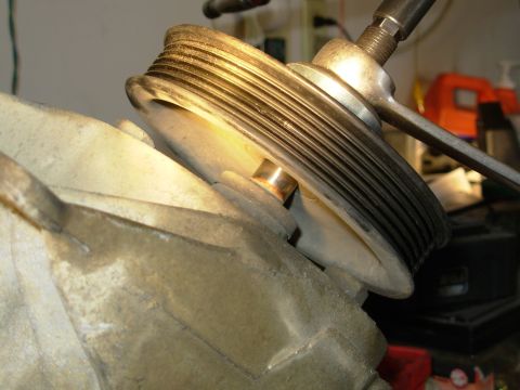 1983 Ford Bronco - As the main shaft threads in, it pushes the pump shaft out of the pulley's steel hub.