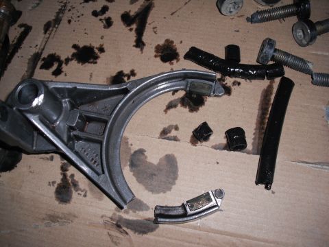 1991 Ford Bronco - Disassembled vehicle part, likely from a transfer case, showing damage and wear.