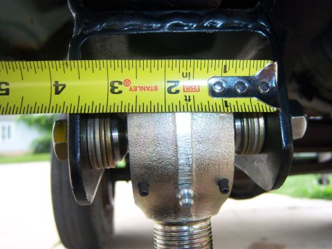1996 Ford Bronco - Measuring a suspension part with a Stanley tape measure. The measurement is around 3.5 inches.