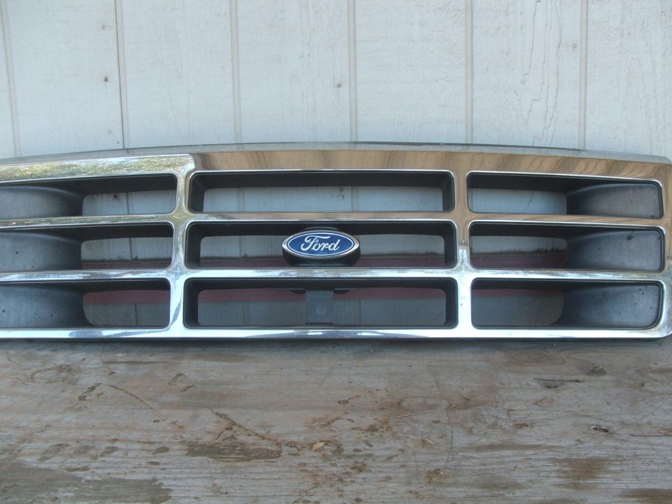 Ford emblem on a chrome grille with horizontal bars