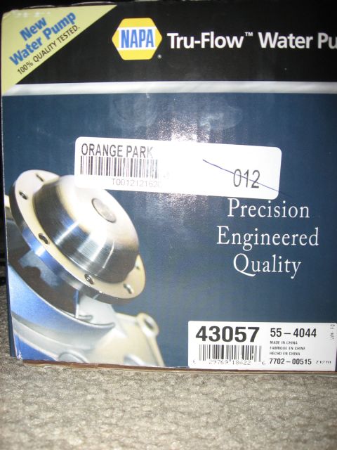 1994 Ford Bronco - Close-up of a NAPA Tru-Flow new water pump box sitting on carpet, printed with "Precision Engineered Quality" and a photo of the pump's mac…