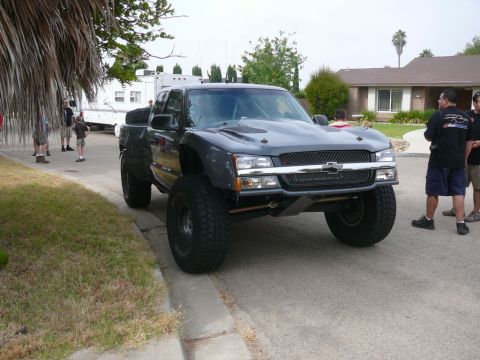1988 Ford Bronco - This modified pickup truck features a prominent Chevrolet grille and aftermarket hood scoops.