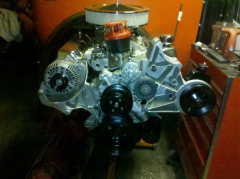 1994 Ford Bronco - A V8 engine is shown with its various components, including the alternator and pulleys.