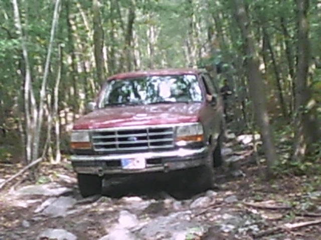 Red SUV on rocky trail, 1992-1997 model year