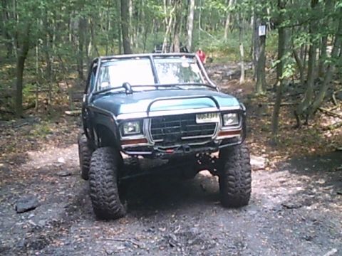 1988 Ford Bronco - This modified SUV is equipped for off-road adventures, with large tires and a protective roll cage.