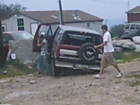 1988 Ford Bronco - A red 1988 Ford Bronco is seen from the rear with a spare tire mounted on the back door.
