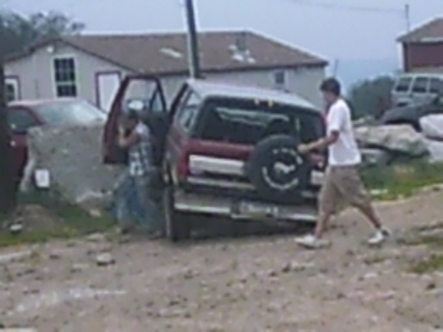 Red 1988 Ford Bronco rear view with spare tire