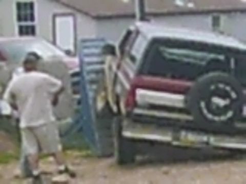1988 Ford Bronco - 1988 Ford Bronco seen from the rear, with a spare tire on the tailgate.