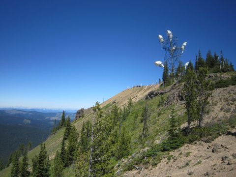 2008 Jeep Wrangler - Communications tower on a mountain slope with distant hills visible.