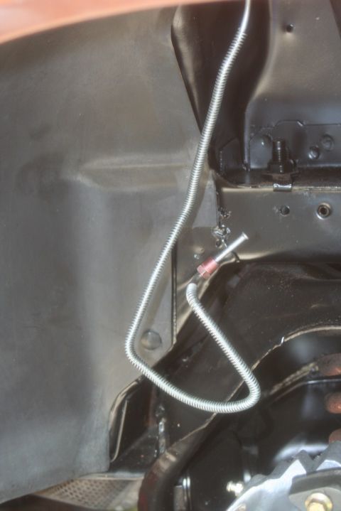 1980 Ford Mustang - This image shows a section of a vehicle's brake line and surrounding chassis components, not a specific model year.
