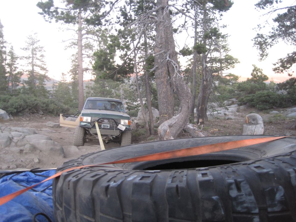 Green 1989 Ford Bronco with winch and off-road tires