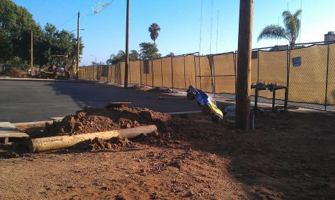 1992 Ford Ranger - A construction scene shows dirt piles and a small vehicle overturned near a utility pole.