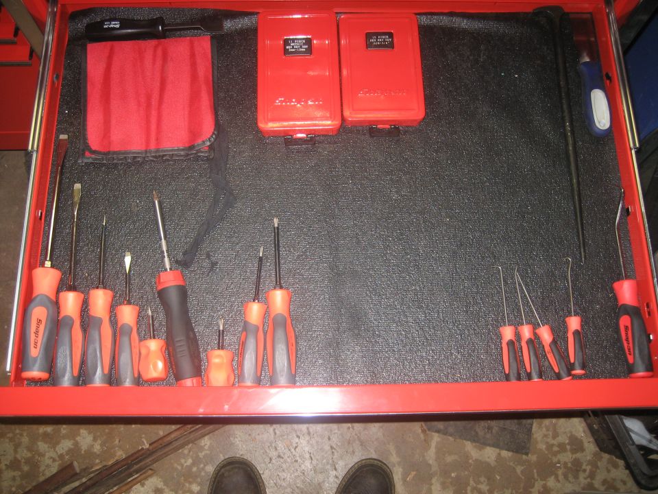 Tool drawer with screwdrivers, picks, and red Snap-on boxes