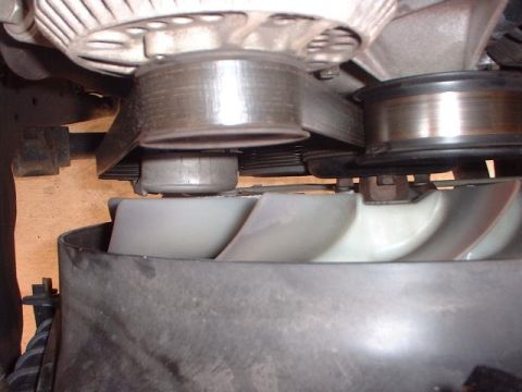 1996 Ford Taurus - Close-up view of the engine's fan and belt system.