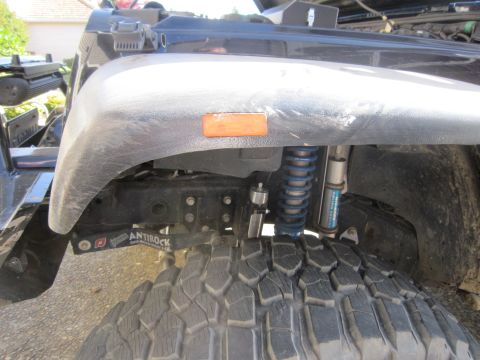2008 Jeep Wrangler - Close-up view of the front fender and suspension system of a Jeep Wrangler, highlighting the Antirock sway bar.
