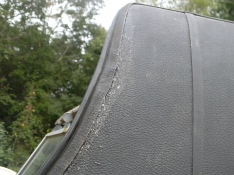 1979 Ford Ranchero - Detail of a damaged vinyl top edge on a vehicle.