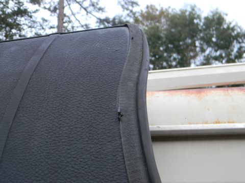 1979 Ford Ranchero - Detail of the interior upholstery, showing texture and a rubber seal against a background structure.