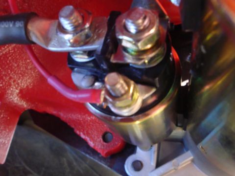1989 Ford Bronco - Close-up view of a vehicle's starter solenoid and wiring connections.