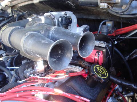 1989 Ford Bronco - Close-up view of an engine's intake manifold and associated wiring.