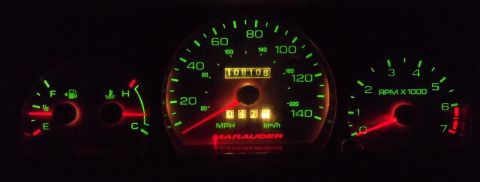 2000 Mercury Grand Marquis - Illuminated car dashboard gauges display speed, RPM, fuel level, and engine temperature.