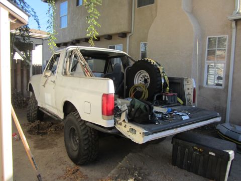 1990 Ford Bronco - This 1990 Ford Bronco is shown with its top removed, revealing a spare tire and tools in the bed.