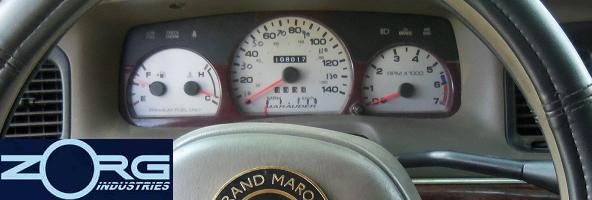 Dashboard with speedometer, tachometer, and fuel gauge. 'Marauder' text visible on speedometer face