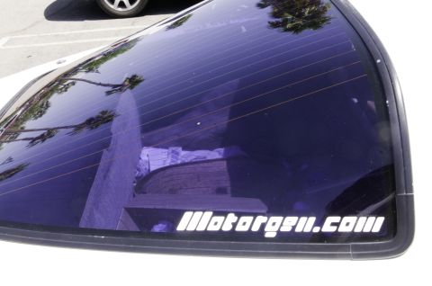 2006 Cadillac STS - Rear window sticker on a car reads "Motorgem.com" with a Supermotors watermark.