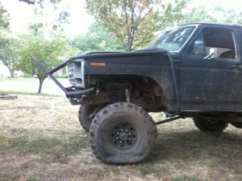 1986 Ford Bronco - This modified SUV features a prominent custom bumper and off-road tires, suggesting a build from the early 1980s.
