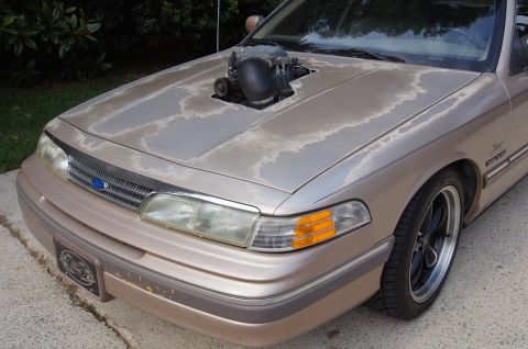 1993 Ford Crown Victoria - This 1993 Ford Crown Victoria features a hood cutout to display its supercharger setup.